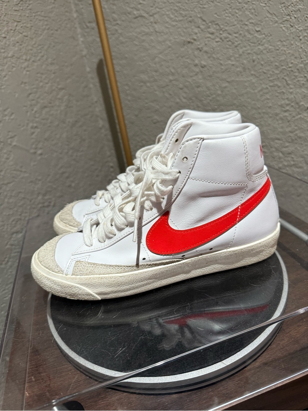 Nike White High-Top Sneakers with Red Swoosh